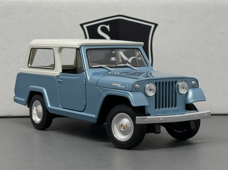 Jeep Jeepster Commando - Welly 1:24 Diecast